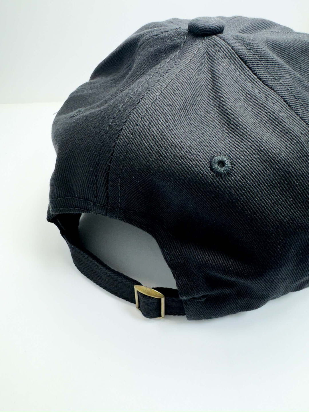 A black baseball cap with the text 'Game Day' embroidered in orange on the front.