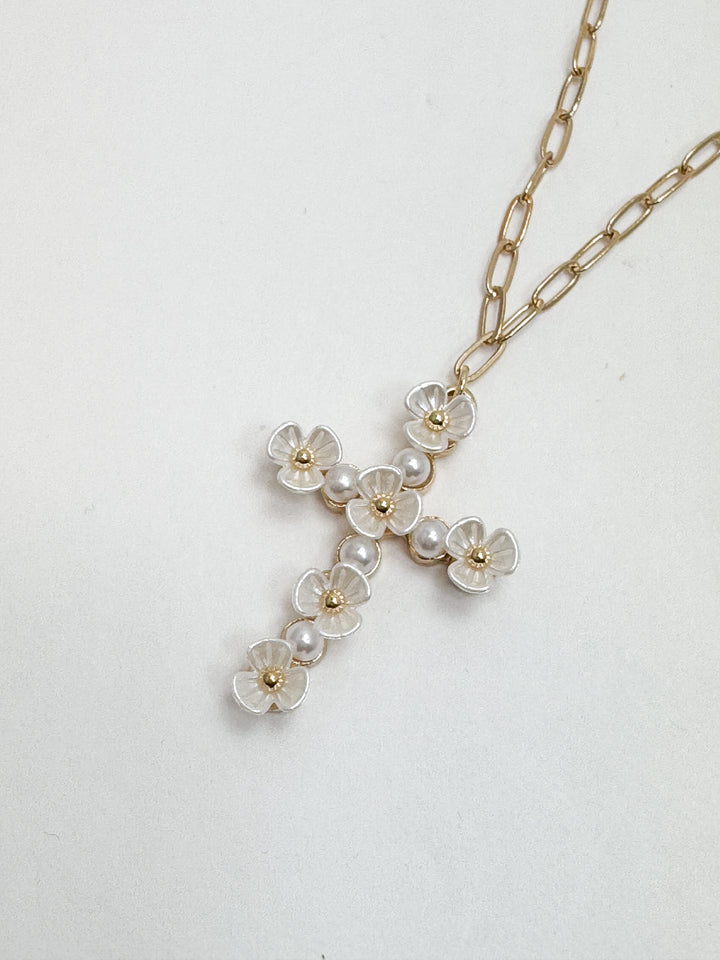 Necklace with floral pendant on a light gray background