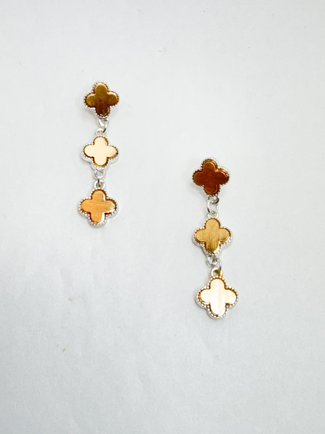 matte gold and silver clover design earrings