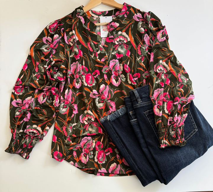 flatlay photo of green and pink floral top