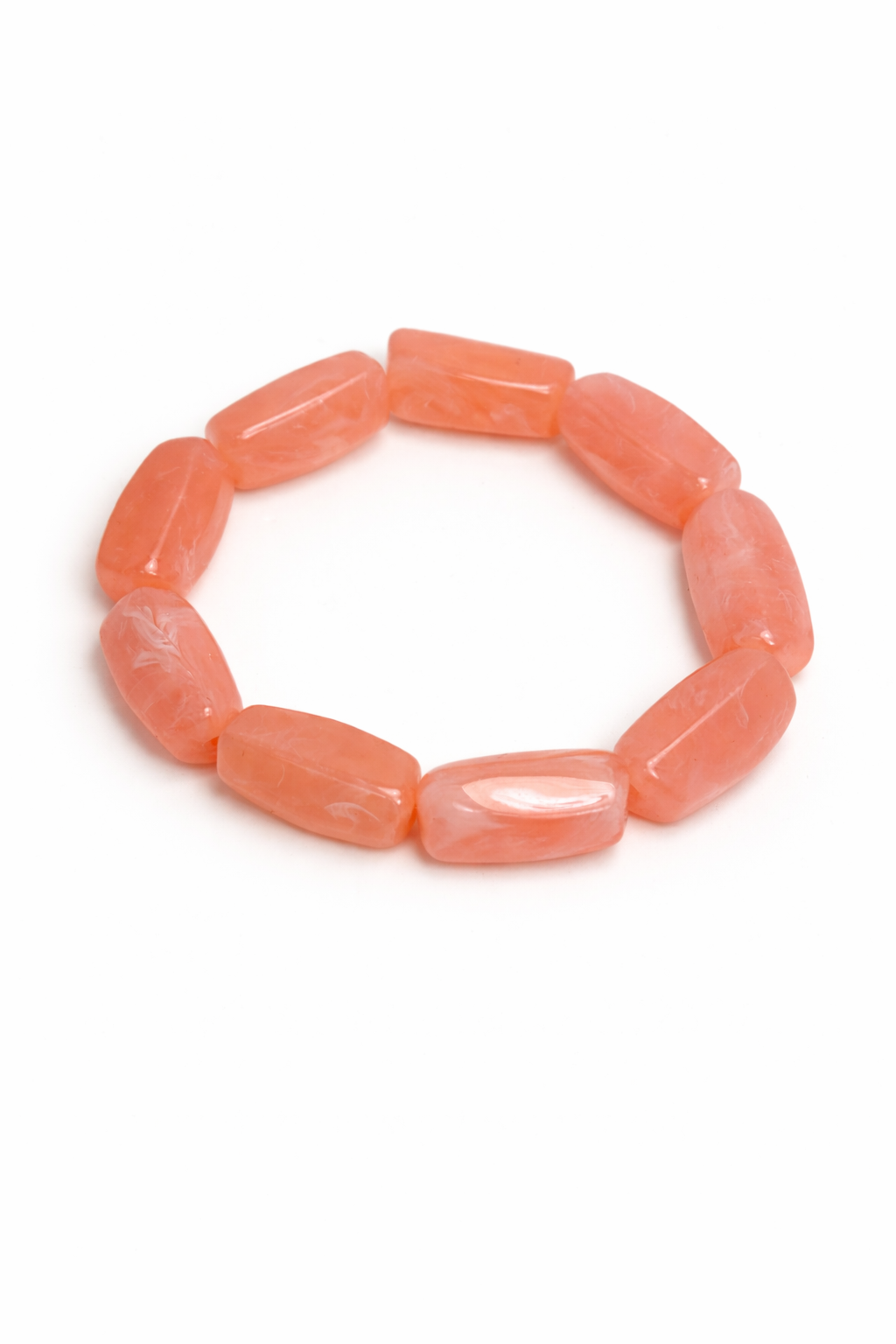 Peach-colored beaded bracelet on a white background