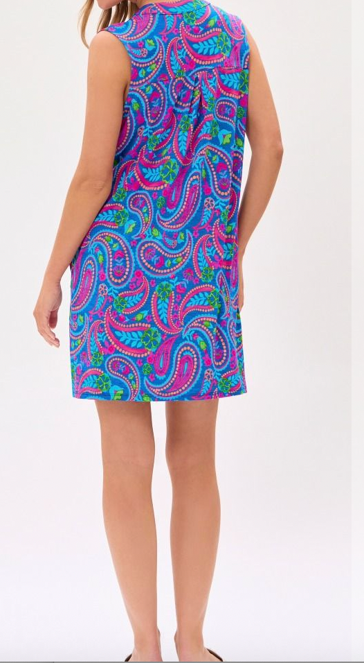 Woman wearing a colorful paisley dress on a white background