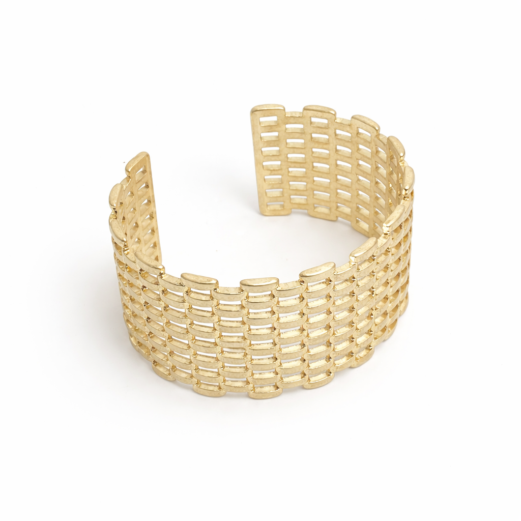 Gold woven bracelet on a white background
