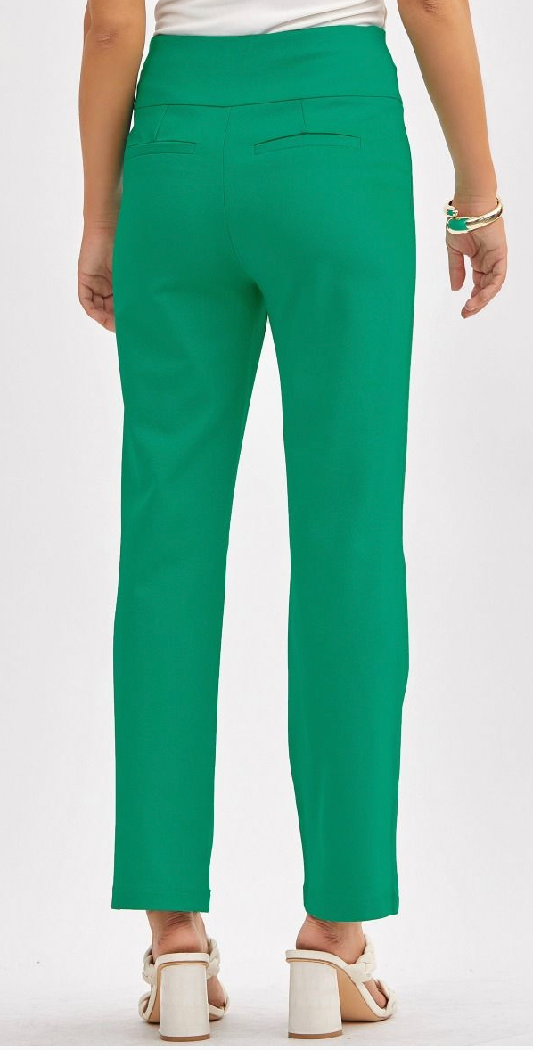 Green pants worn by a person on a white background