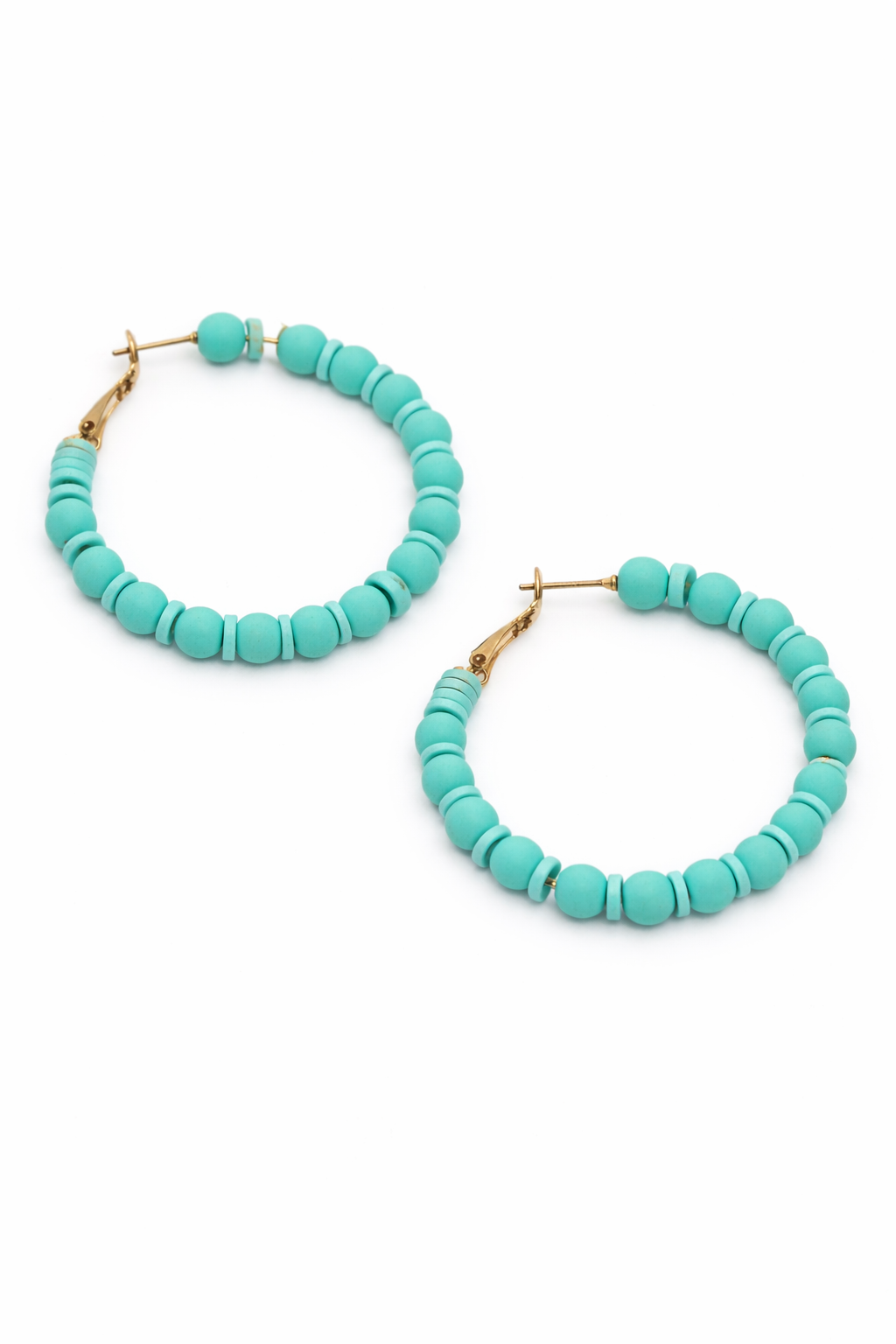 Turquoise beaded hoop earrings on a white background