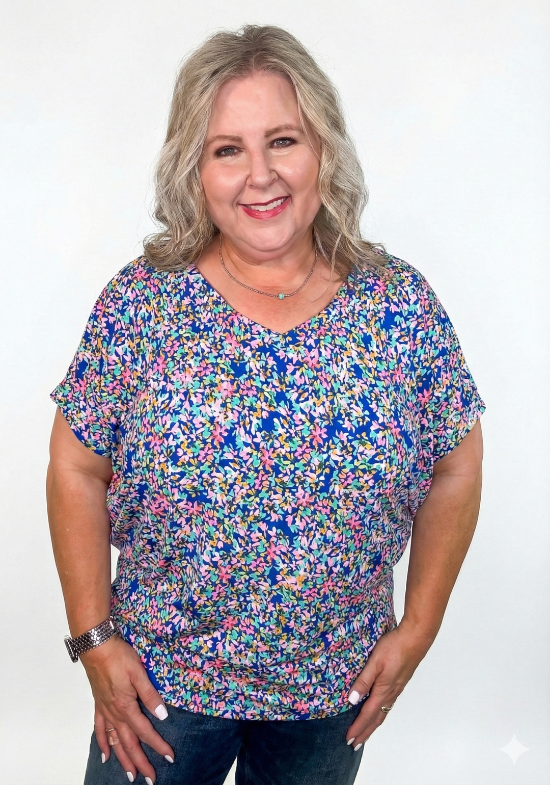 model wearing a blue floral v-neck top
