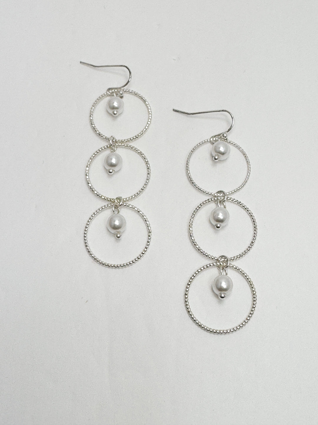 dainty open silver circles with pearl accents inside each one