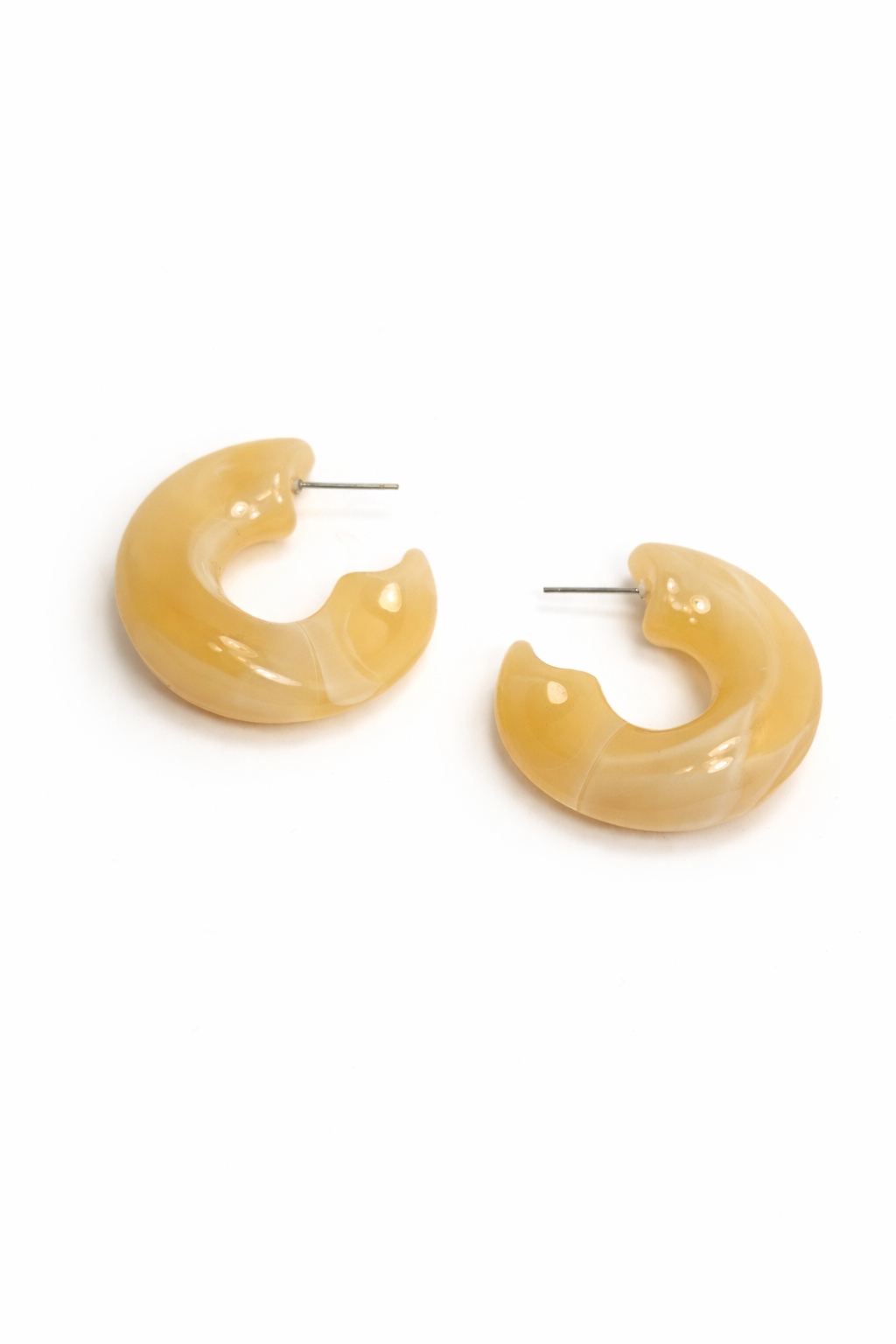 Pair of yellow hoop earrings on a white background