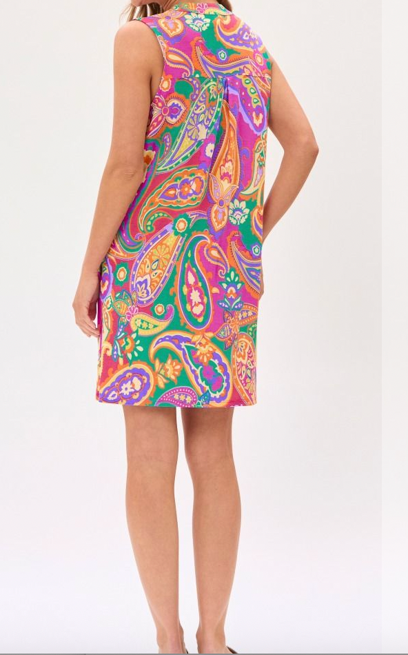 Colorful paisley dress worn by a person on a white background