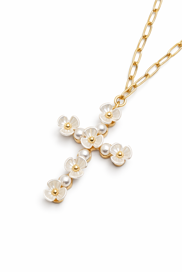 Gold necklace with a cross pendant on a white background