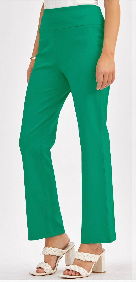 Green pants worn by a person on a white background