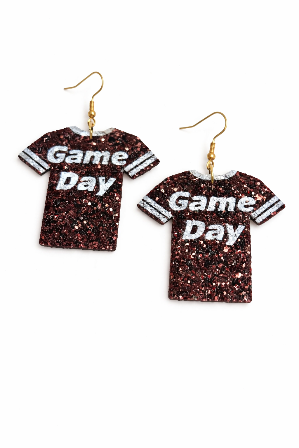 Pair of glittery 'Game Day' t-shirt earrings on a white background