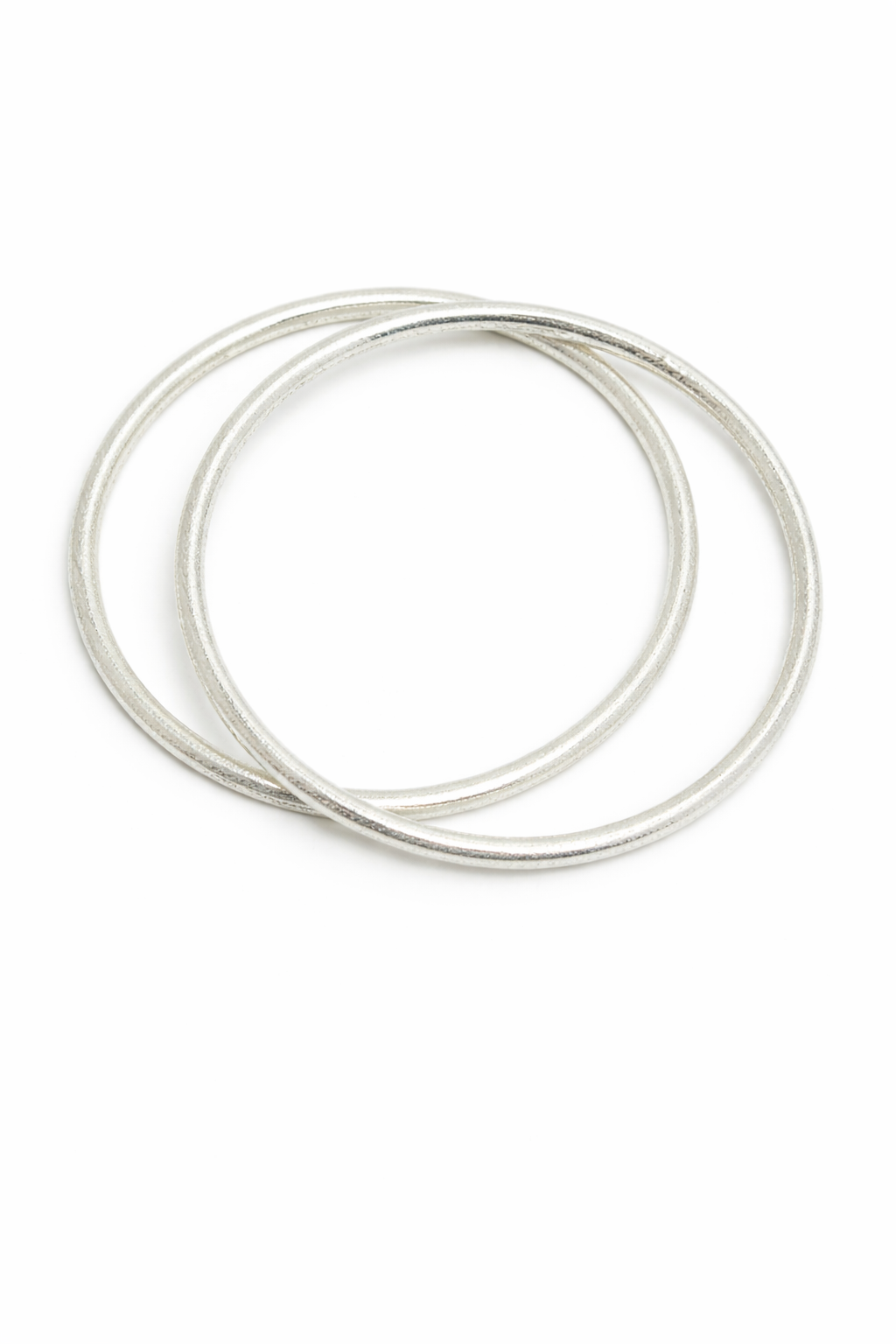 Two silver bangles on a white background