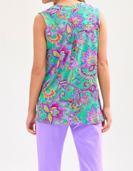 Person wearing a colorful sleeveless top with floral pattern on a white background