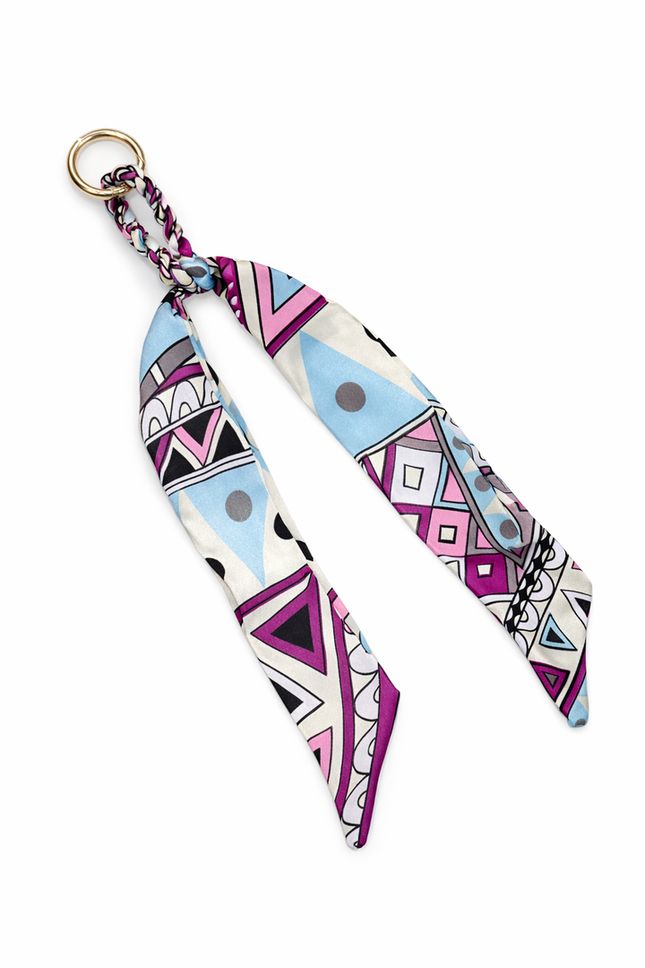Multicolored geometric patterned strap on a white background