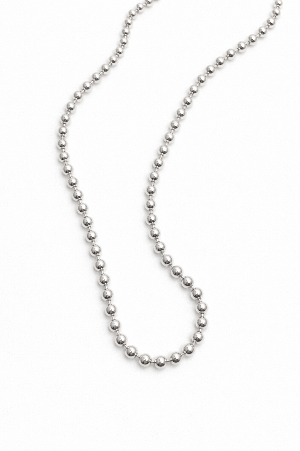 Silver beaded necklace on a white background