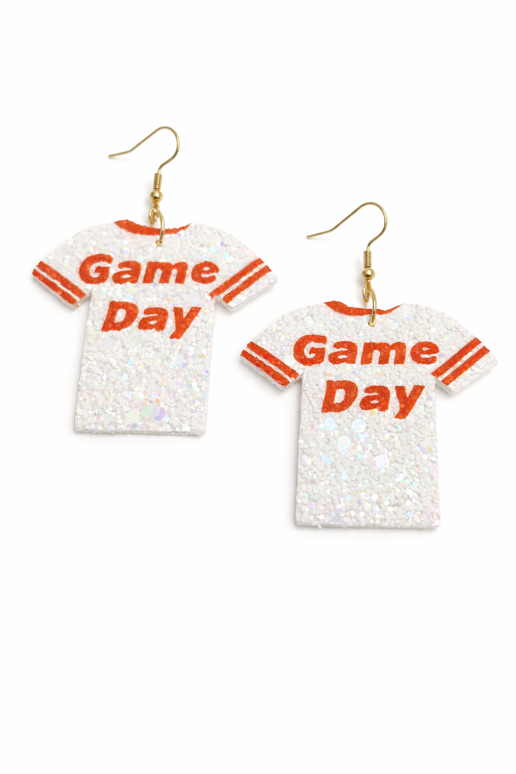 Earrings shaped like 'Game Day' t-shirts on a white background